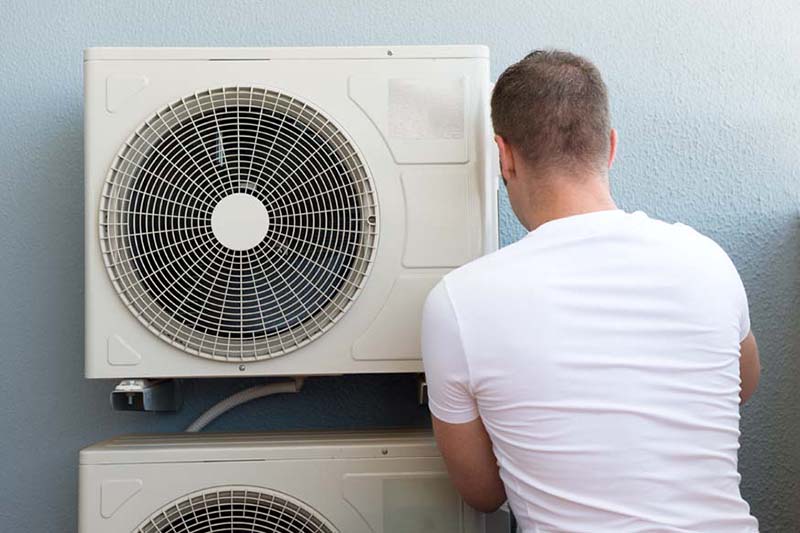 Male technician installing air-conditioning system, Why Do I Need AC Maintenance Now? | HVAC in San Jose, CA