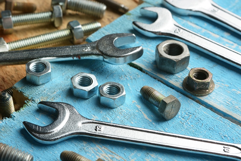 Wrenches and bolts on a blue surface, Heat Pump Maintenance Tips | HVAC Service, Repair | San Jose, CA