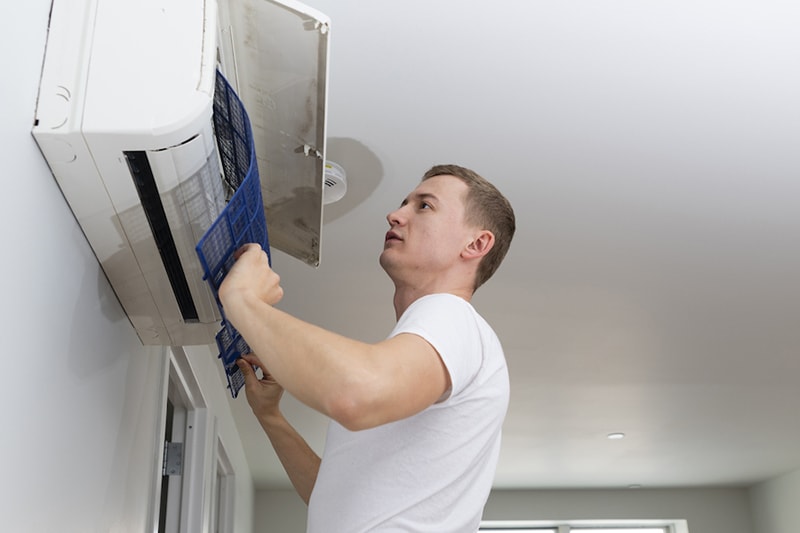 Young man cleaning filters in the air-conditioning split device, young man cleaning filters in the air-conditioning split device, The Problem With Clogged Air Filters | Indoor Air Quality | Santa Clara, CA