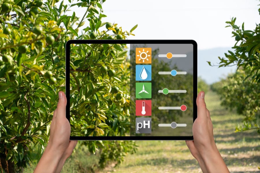 Person holding tablet measuring the air quality levels