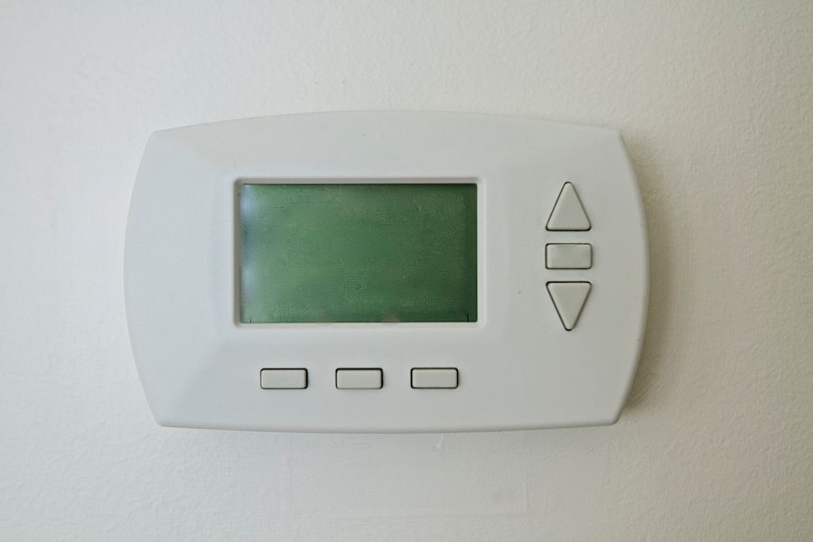 Image of a thermostat. Zone Your Way to Comfort.