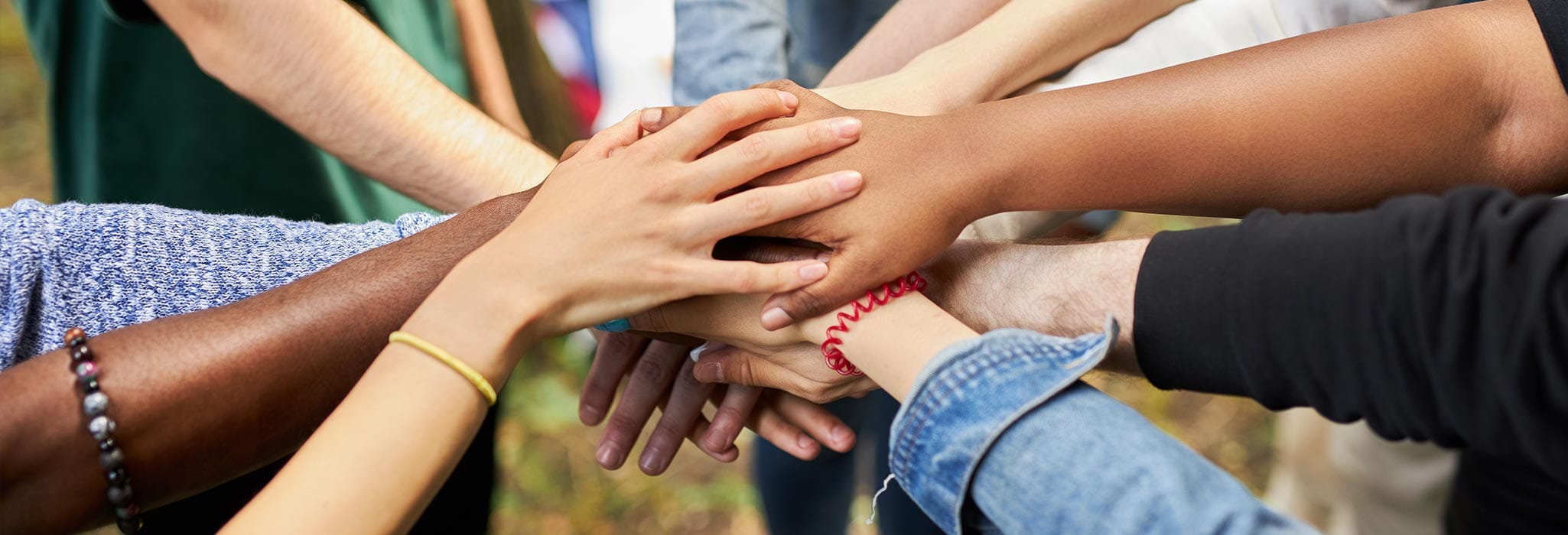 A group of hands on top of one another